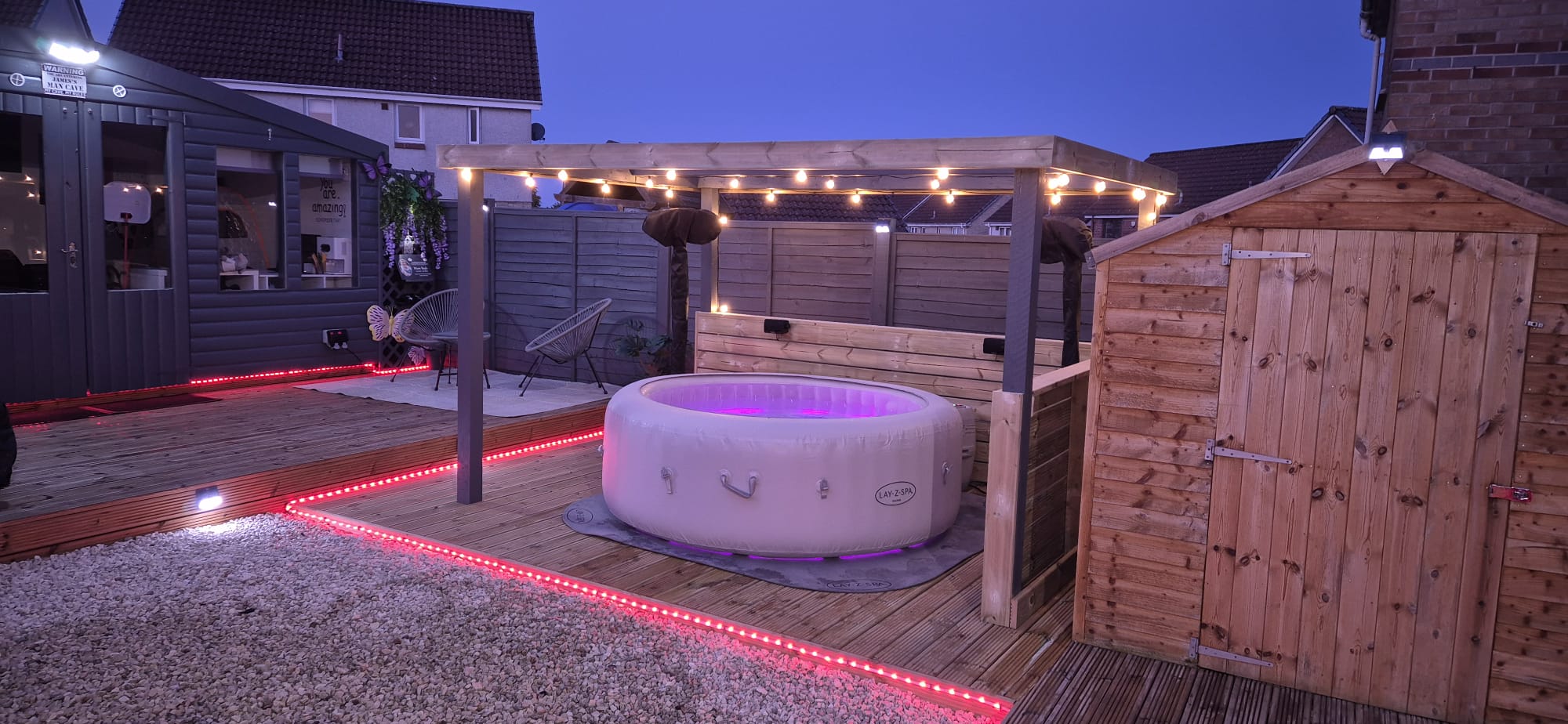 Pergola with hot tub, festoon lights and LED-edged decking