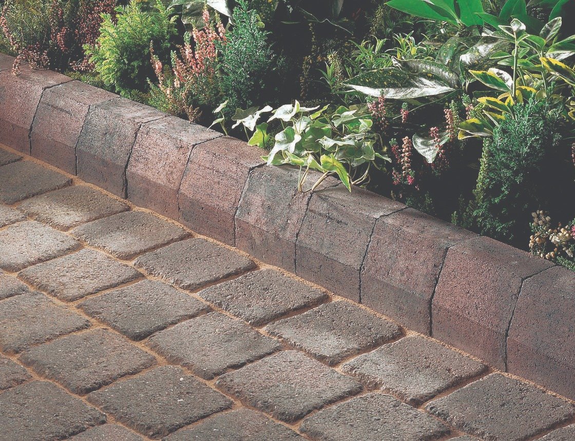 Multitone block paving framed by raised charcoal edging