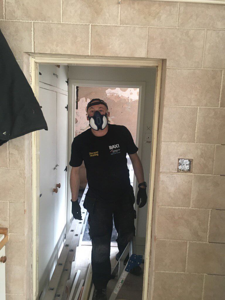 Peter from Discount Heating NW on site in Baxi branded workwear