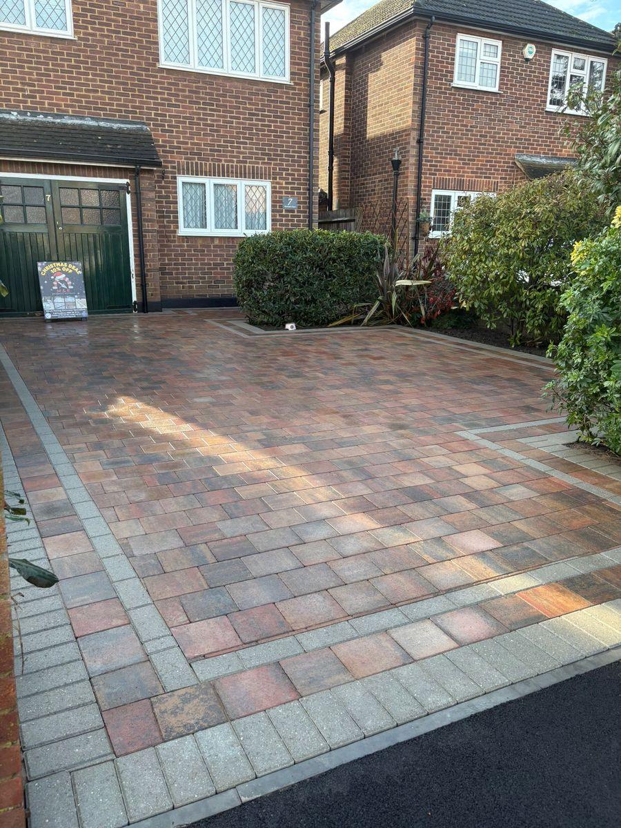 Autumn-tone block paving driveway with a charcoal border