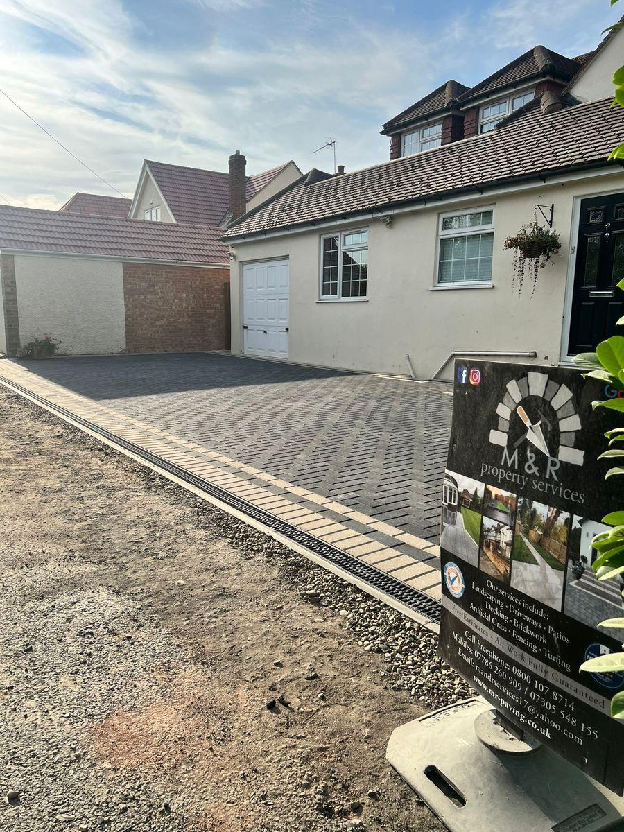 Block paving driveway with M&R signboard