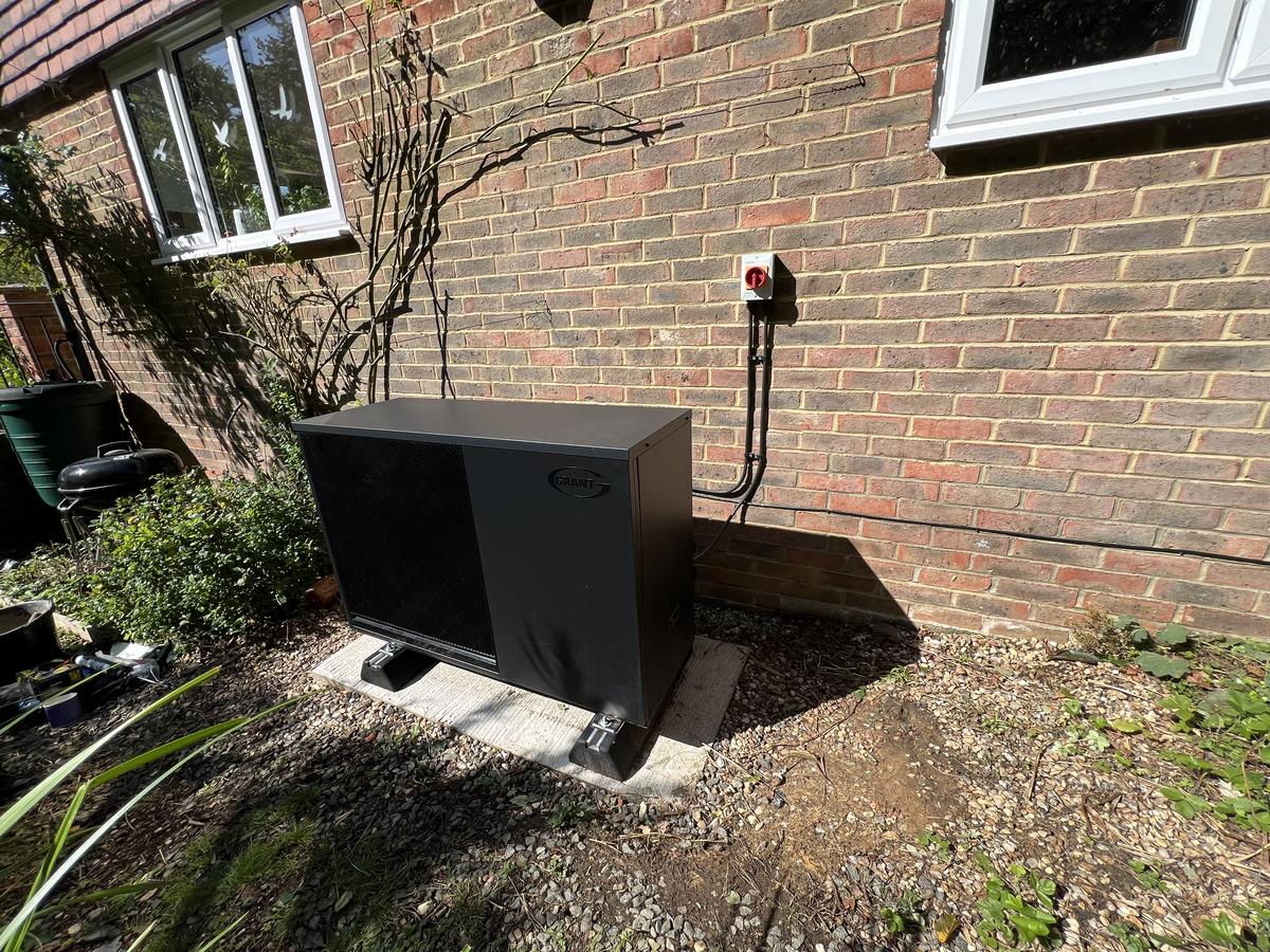 Heat pump on a gravel base, installed by Optimum HVAC