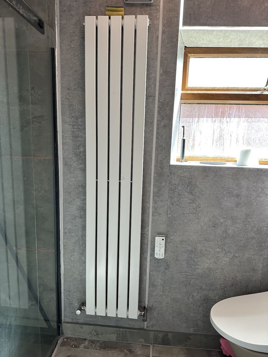 Finished bathroom from a Tami Plumbing fitting job