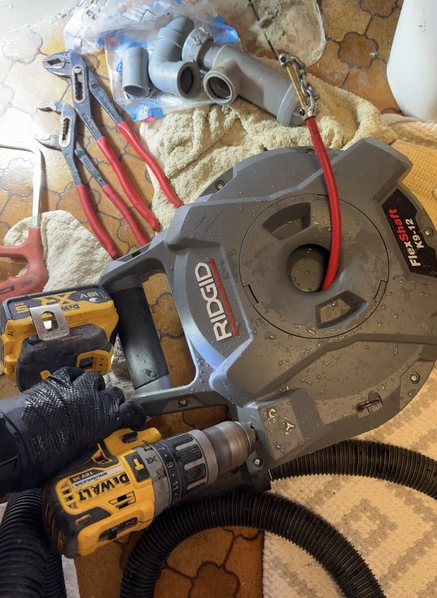 Drain clearing equipment including a RIDGID CCTV camera and DeWalt power tools