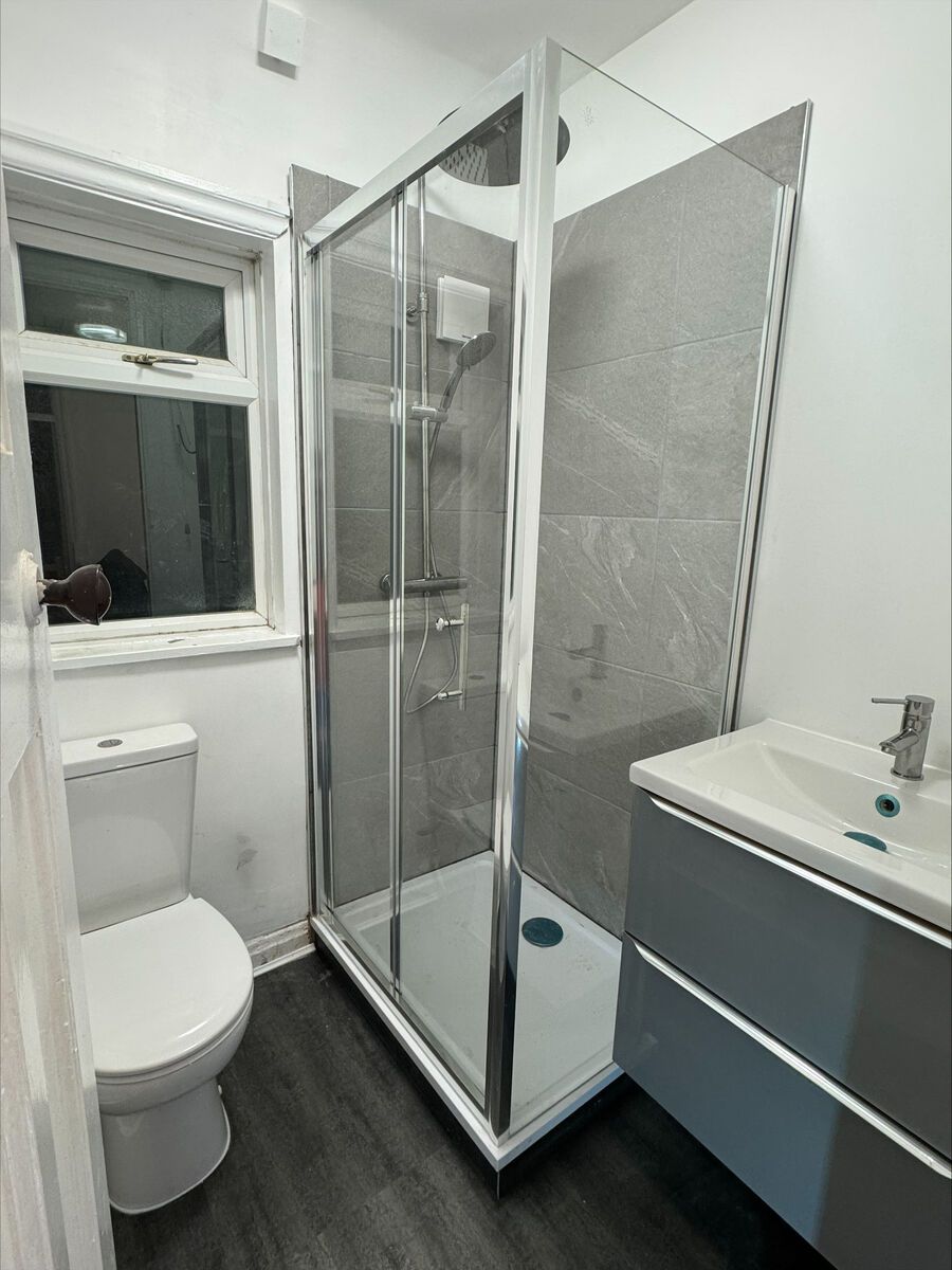 After photo for Complete bathroom refit with walk-in shower, vanity unit, and new flooring
